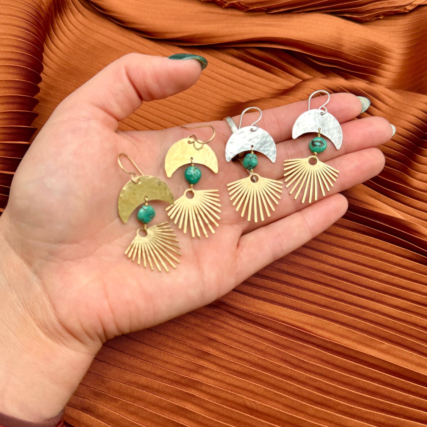 Fluff Hardware Solstice Earrings featuring delicate gold hoops with intricate leaf-shaped charms, stylish jewelry for women.