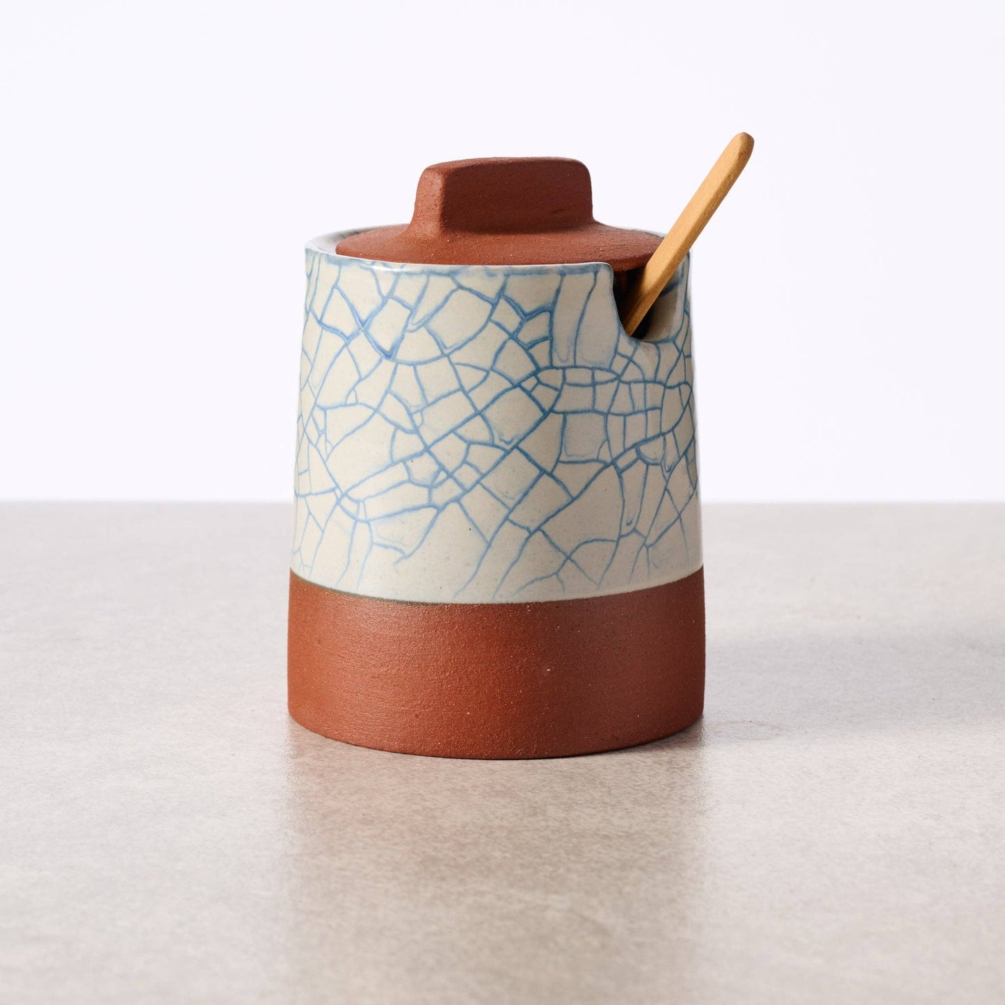 Ciya Blue Crackle Honey Pot by Ten Thousand Villages, decorative ceramic honey jar with a crackle glaze and lid.