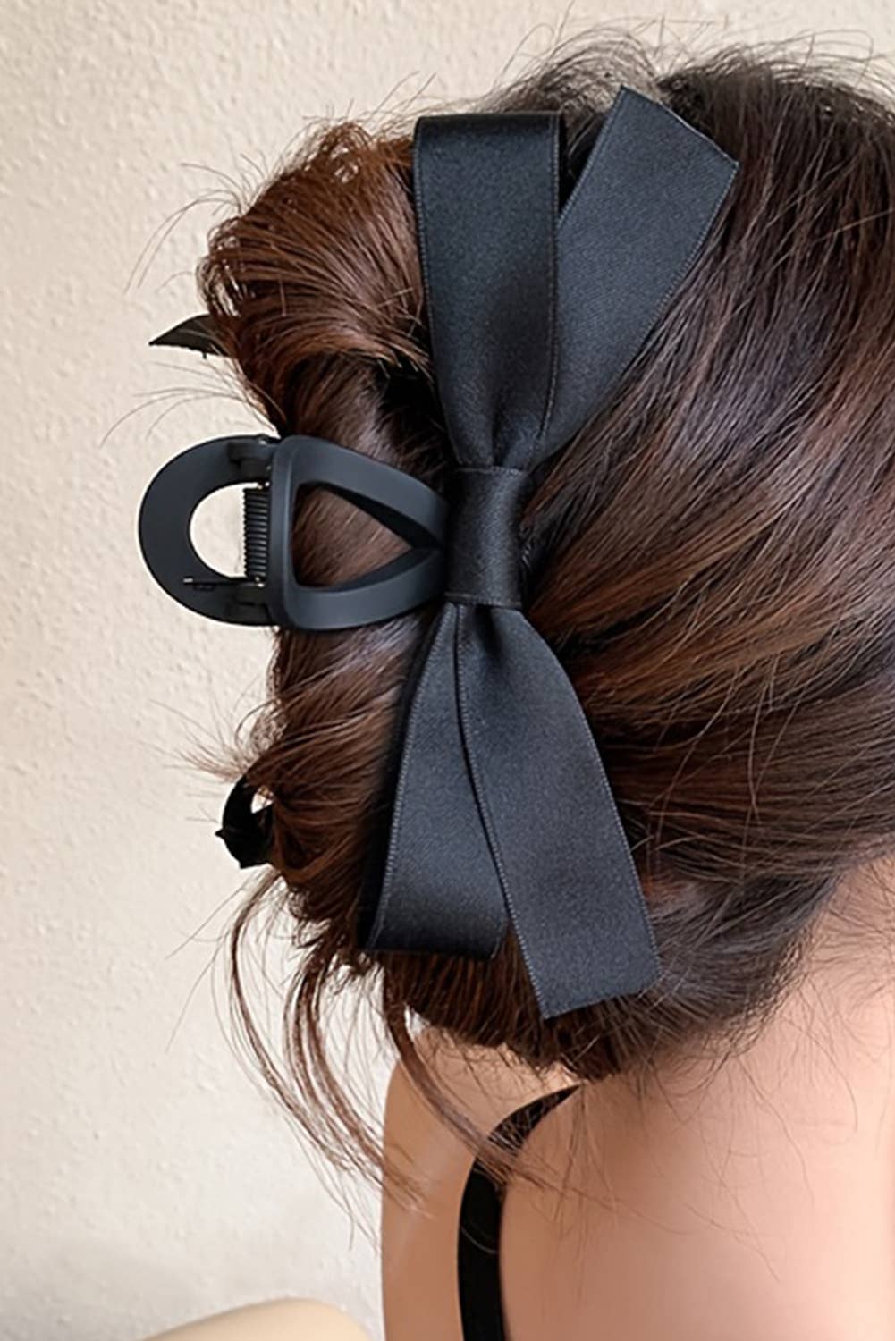 Large LDC Bow Decor Hair Claw Clip by Little Daisy Closet, featuring a stylish bow design and sturdy hair gripping teeth.
