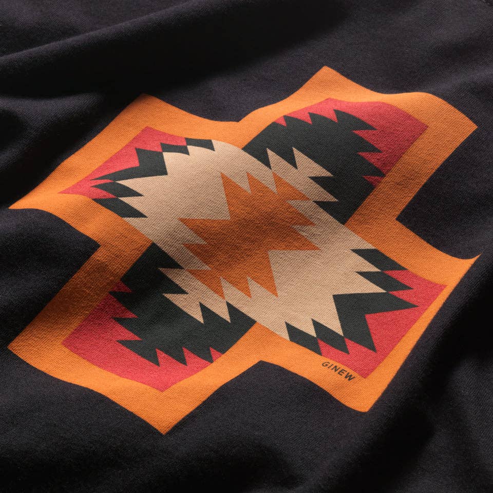 Black Ginew Four Directions T-shirt with white graphic design featuring symbolic patterns on front and back.