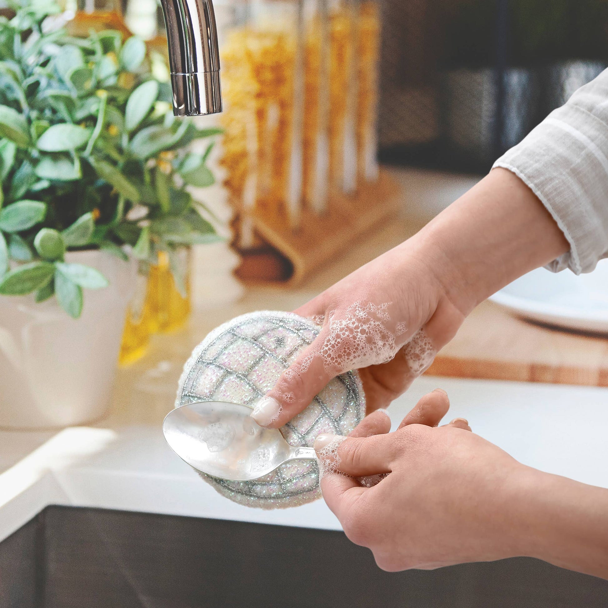 Set of two Fred & Friends Disco Ball Sponges featuring shiny, spherical dishwashing sponges with a fun, reflective disco ball design.