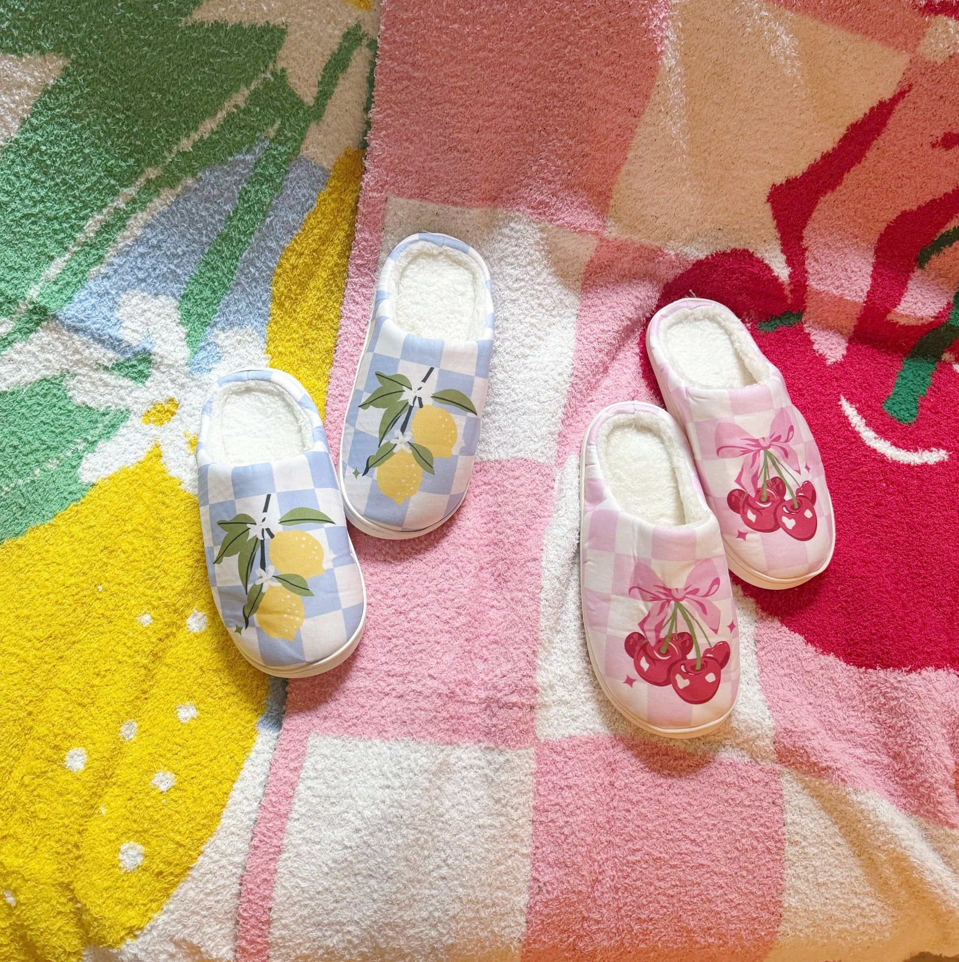 Ellison+Young Cherry Bow Check lounge slippers with cozy interior and stylish red and white check pattern, perfect for comfortable home wear.