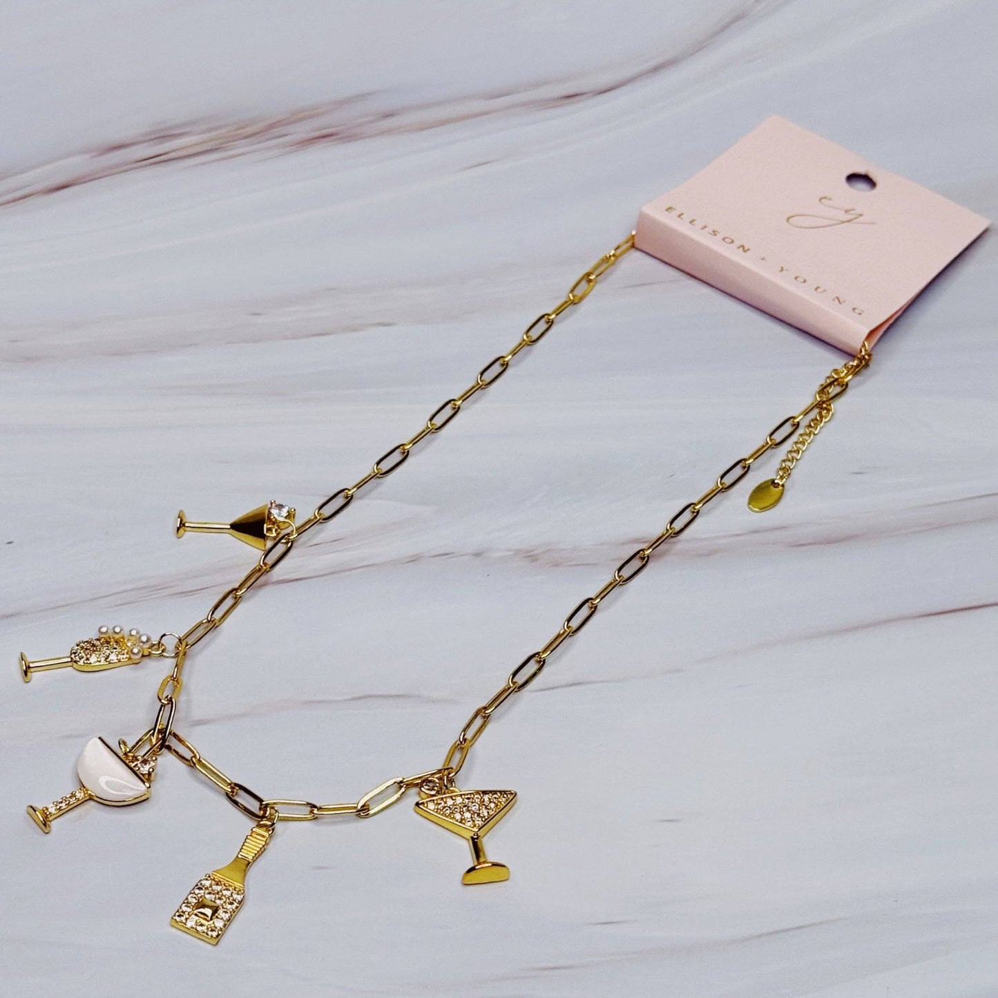Ellison+Young Cheers To Happiness multi charm necklace with colorful charms on a delicate chain, stylish and vibrant jewelry piece.