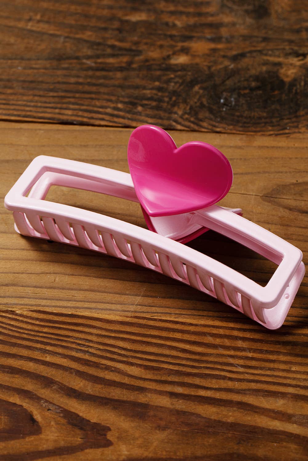 Little Daisy Closet Valentine's minimalist heart design hair claw clip showing a sleek, modern hair accessory with a heart motif.