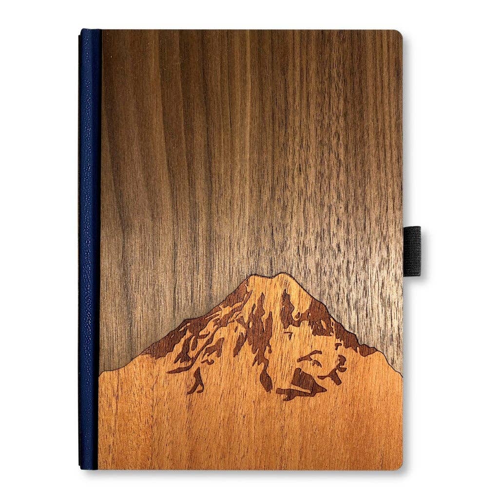 Handcrafted 6x8 wood journal with smooth wooden cover and visible grain, featuring a classic binding for writing or sketching.