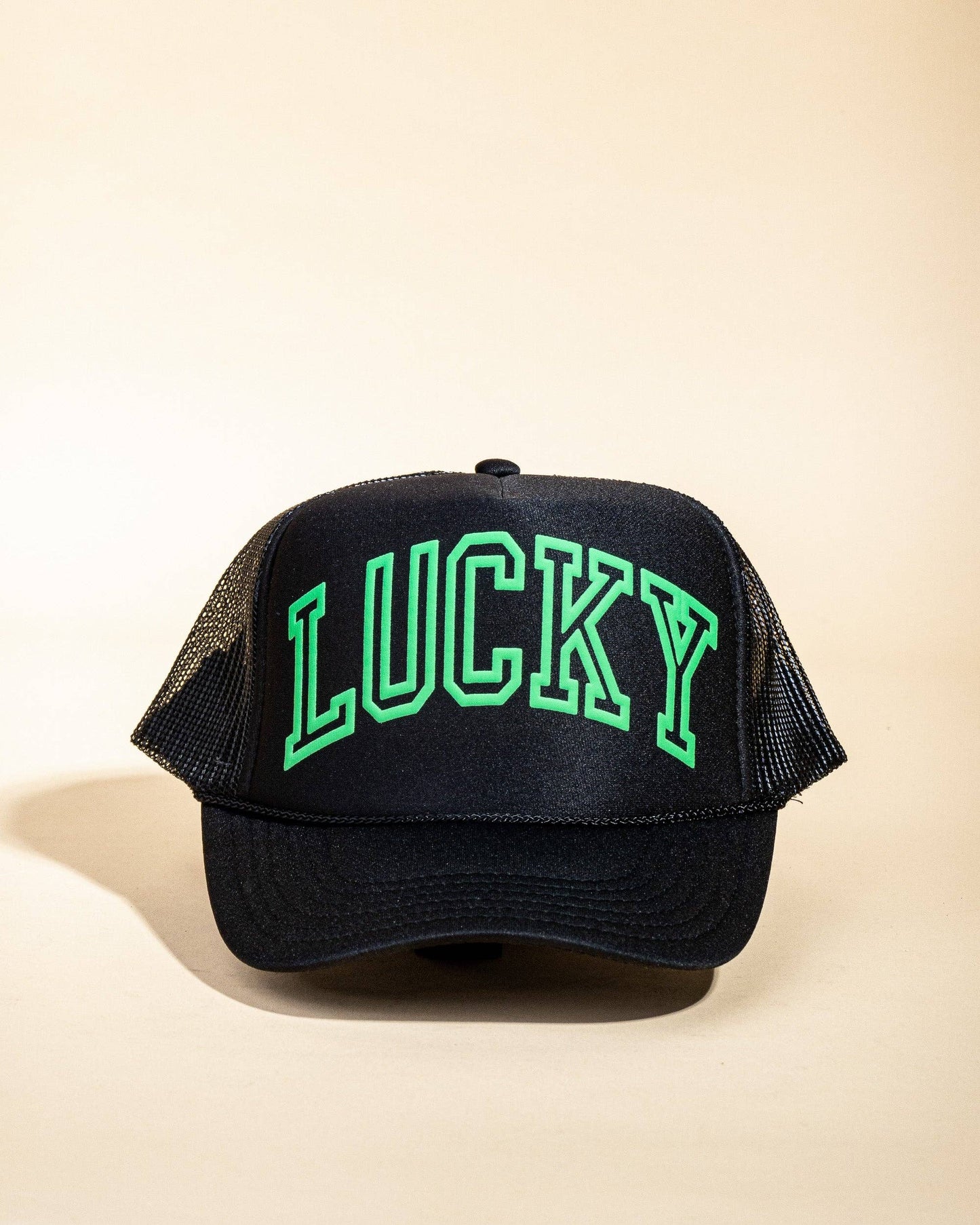 Ascot + Hart Lucky Trucker hat featuring a classic design with adjustable strap and embroidered logo, worn for casual style.