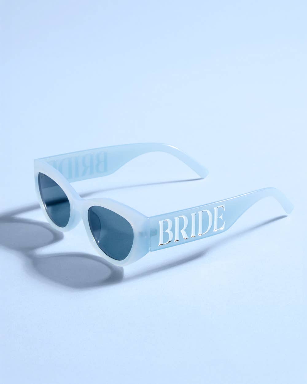 Something Blue Sunnies by xo, Fetti featuring bride embossed sunglasses perfect for bachelorette parties and bridal gifts.