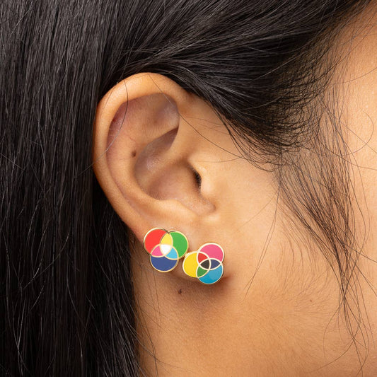 Yellow Owl Workshop RGB and CMYK earrings featuring colorful, geometric enamel designs on silver posts.