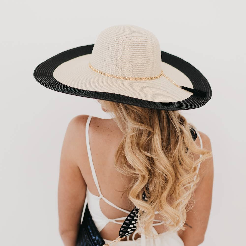 Pretty Simple Miami Summer wide floppy sun hat with a breathable straw material and wide brim for sun protection.