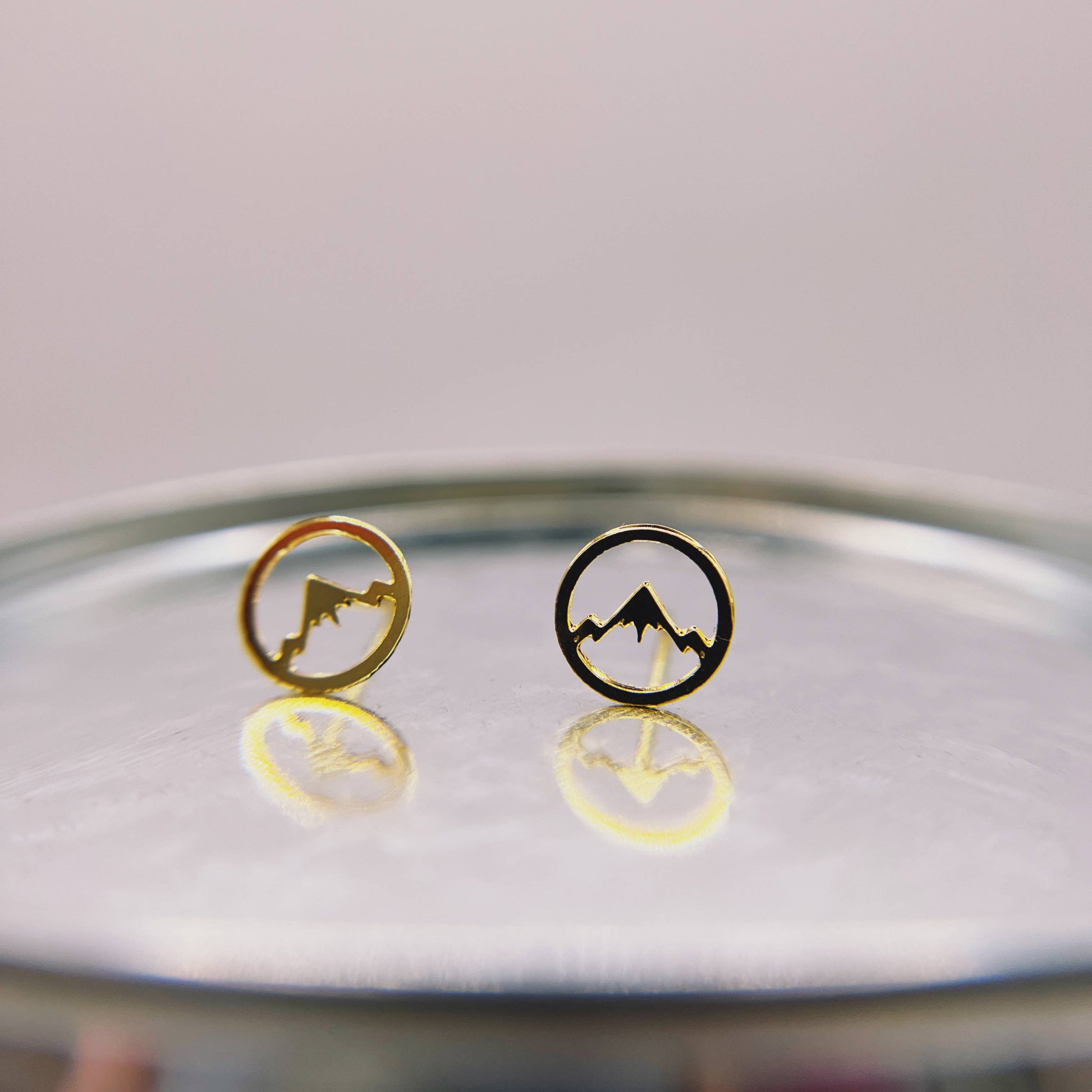 Mountainscape stud earrings by Made of Mountains featuring detailed mountain design in silver.