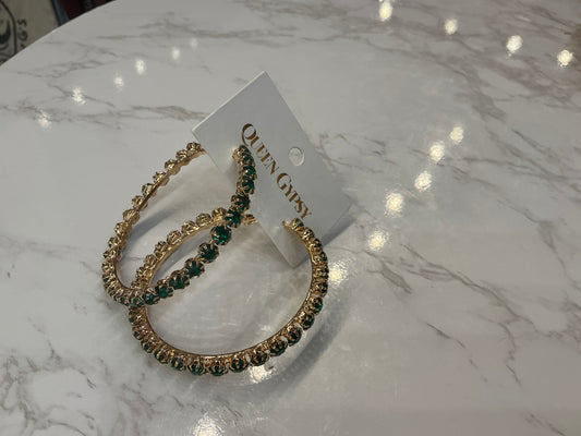 Gold hoop earrings by Queen Gypsy with green crystals, featuring a stylish and elegant design.
