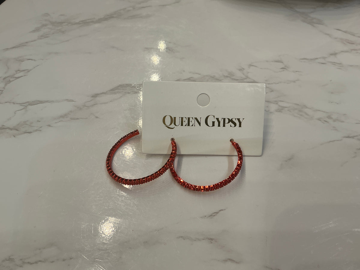 Red crystal hoop earrings from Queen Gypsy featuring vibrant red crystals and a stylish hoop design.