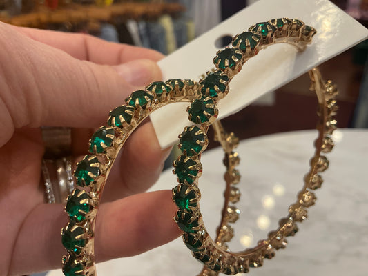 Gold hoop earrings with green crystals from Queen Gypsy featuring a stylish, elegant design.