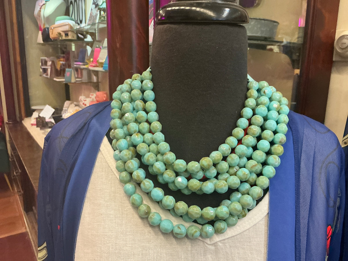 Beaded collar necklace by Queen Gypsy featuring colorful beads and intricate design, close-up view of the jewelry piece.