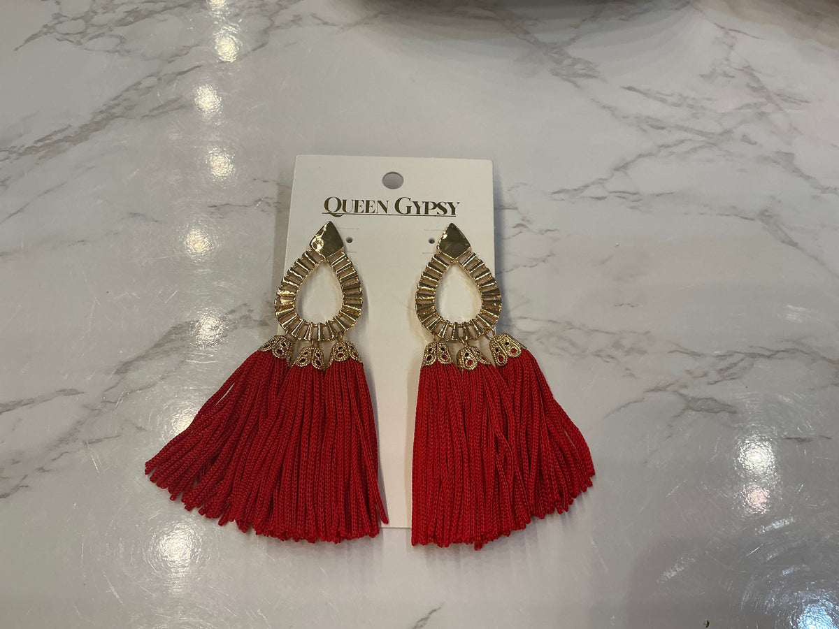 Queen Gypsy Gypsy Queen Tassel Earrings with colorful tassels and metal accents, hanging from pierced ears for a boho-chic look.
