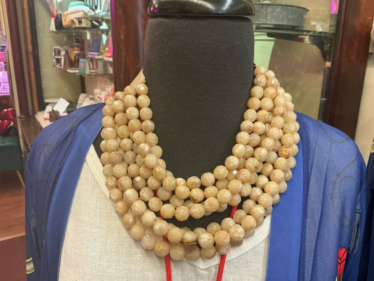 Queen Gypsy beaded collar necklace featuring colorful beads and intricate design, styled as a statement jewelry piece.