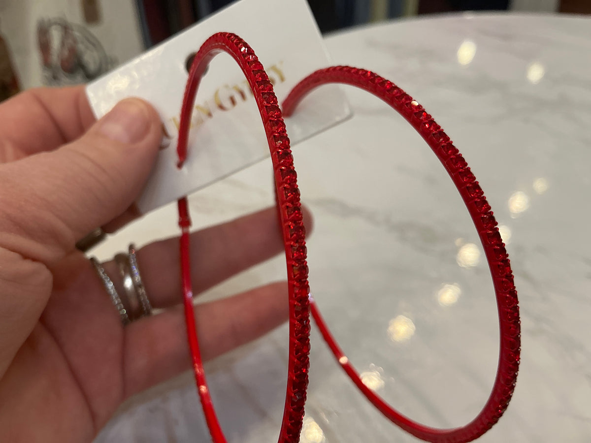 Large red crystal hoop earrings by Queen Gypsy featuring bold red hoops with sparkling red crystals.