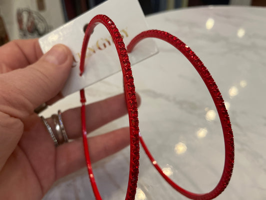 Large red crystal hoop earrings by Queen Gypsy featuring bold red hoops with sparkling red crystals.