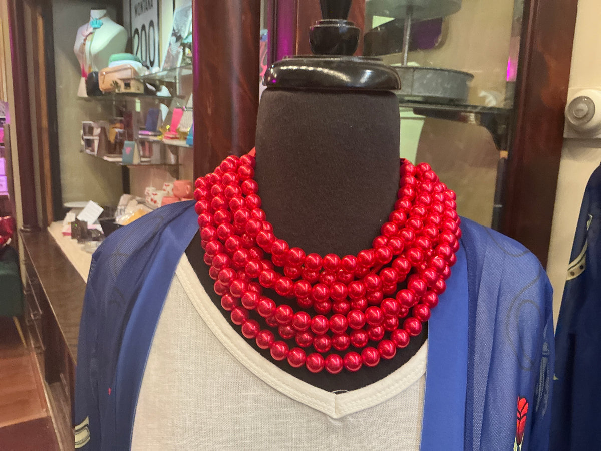 Queen Gypsy beaded collar necklace featuring colorful beads and intricate design on a neutral background.