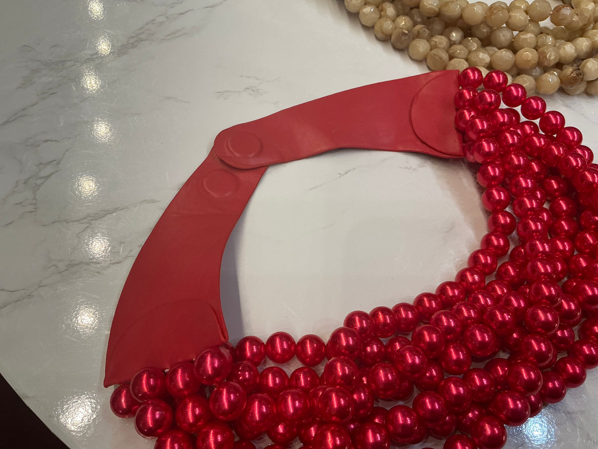 Beaded collar necklace by Queen Gypsy featuring colorful beads and intricate design, styled as a statement jewelry piece.