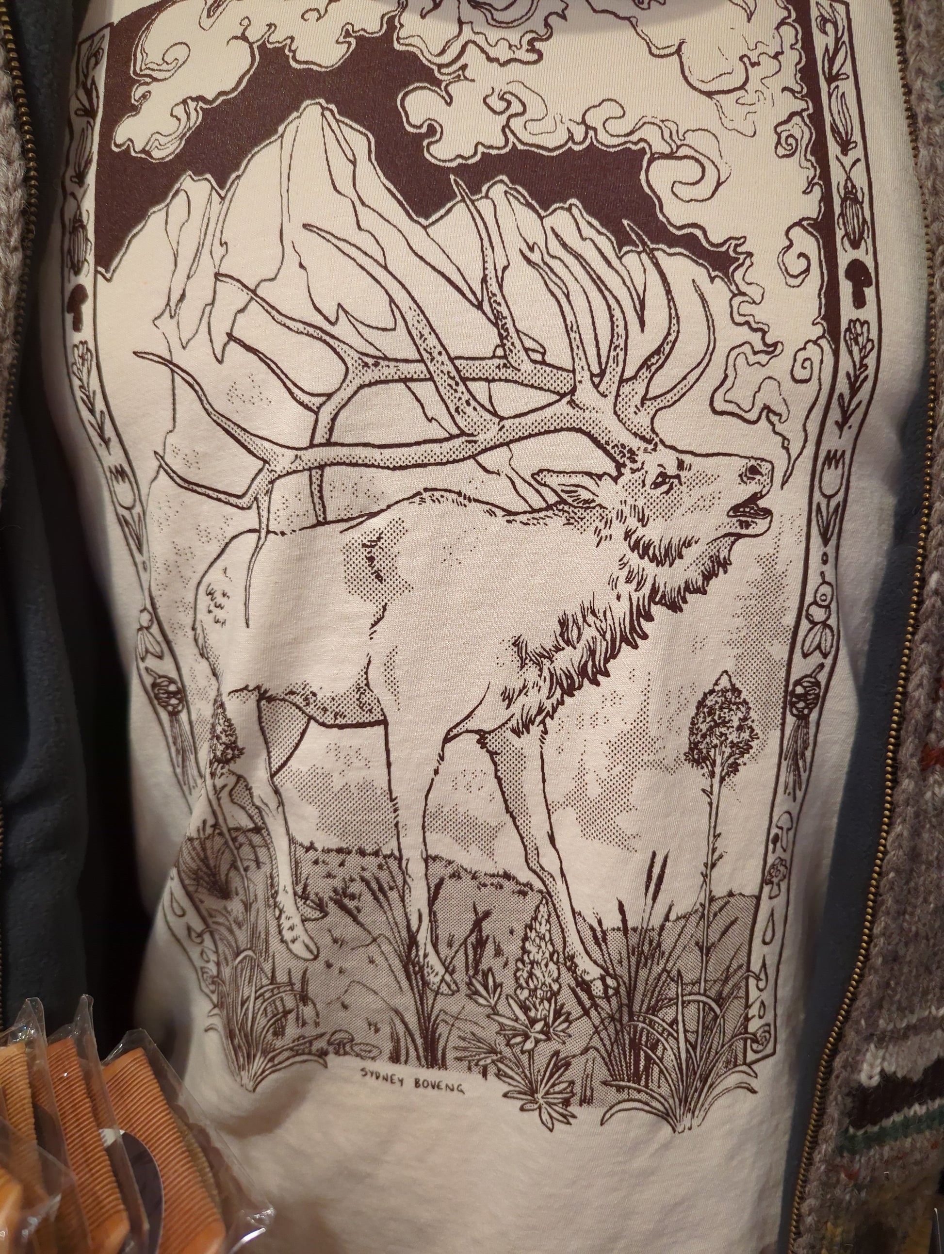 Sydney Boveng Big Boy Bugling Elk T-shirt featuring a colorful elk bugling graphic on soft fabric.