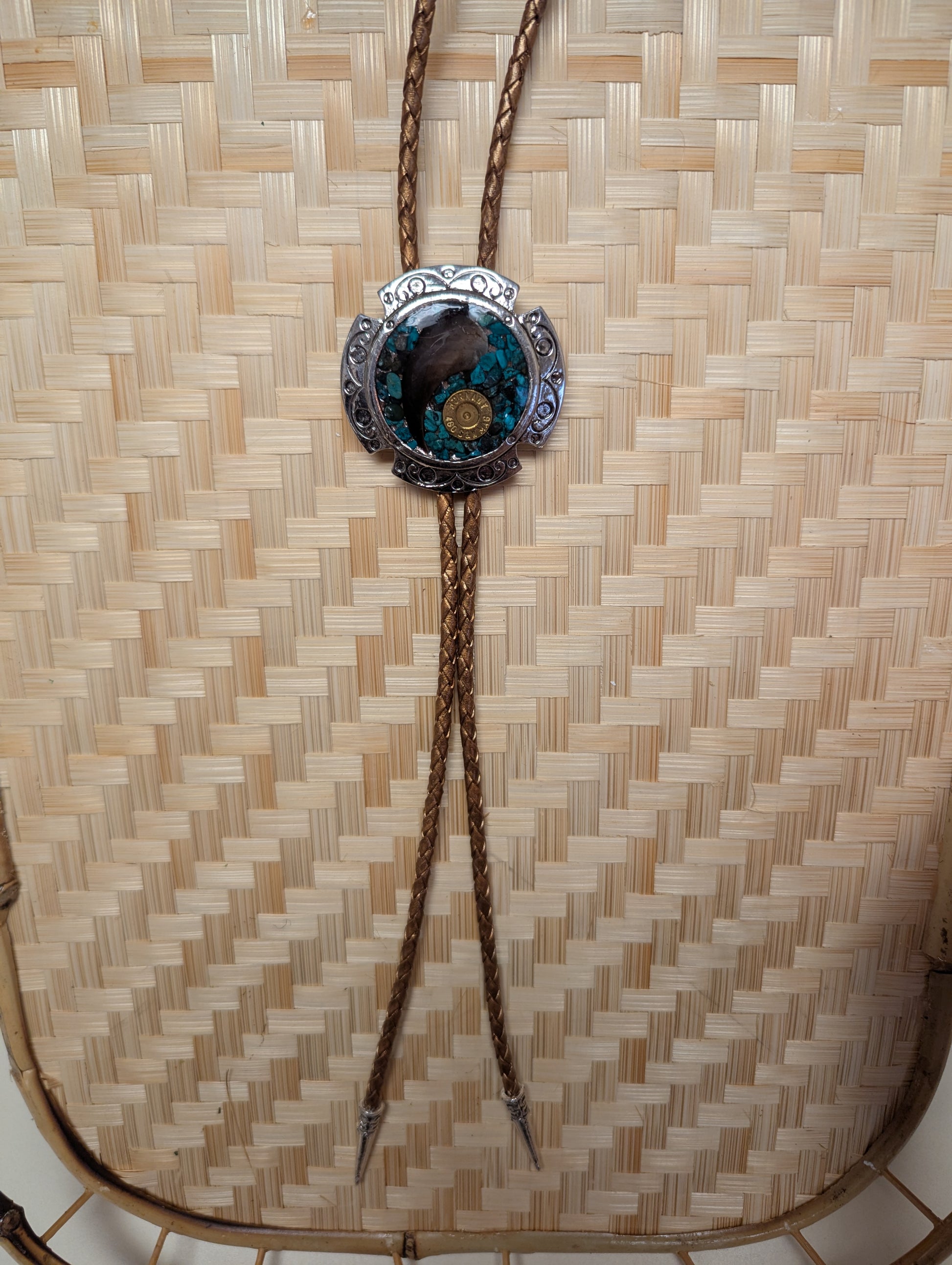 BadAssBabe Badass Bolo Tie with a detailed decorative clasp and leather cord, stylish western accessory for men and women.