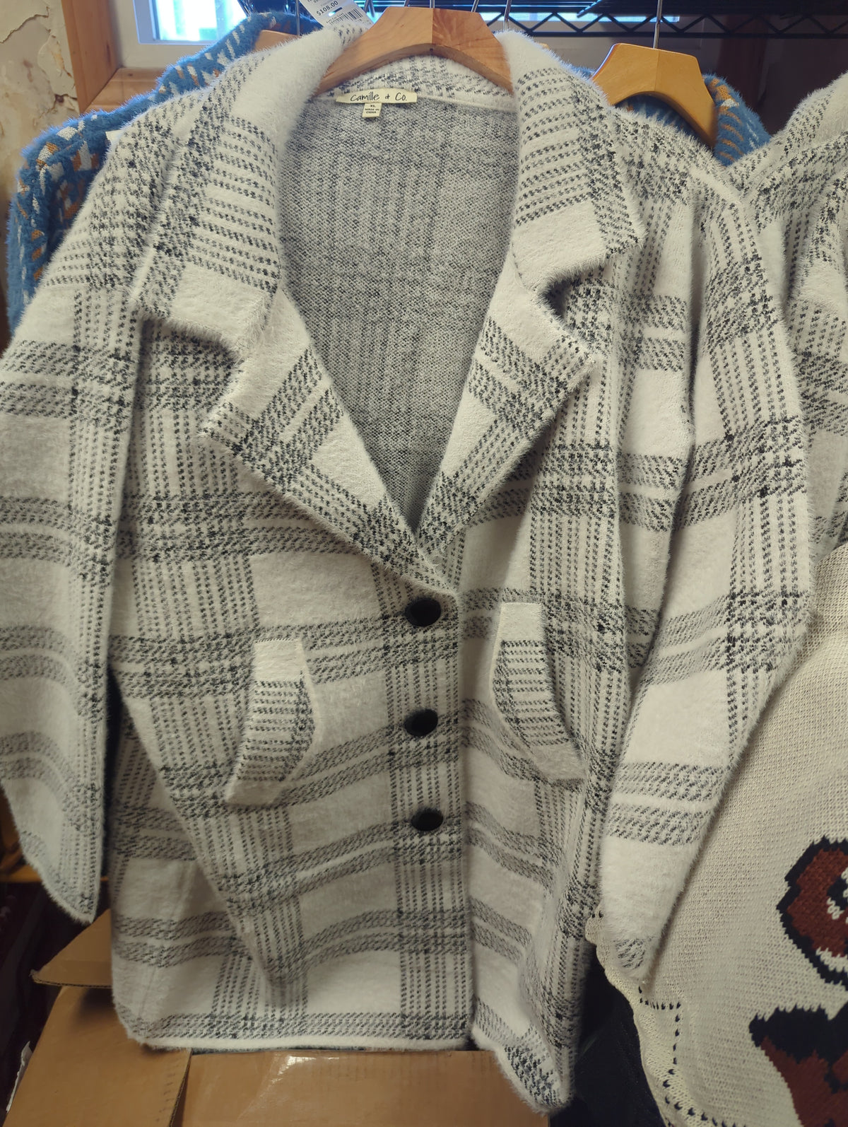 Camille & Co. soft car coat jacket in neutral fabric, showcasing a cozy, stylish outerwear design with a collar and front buttons.