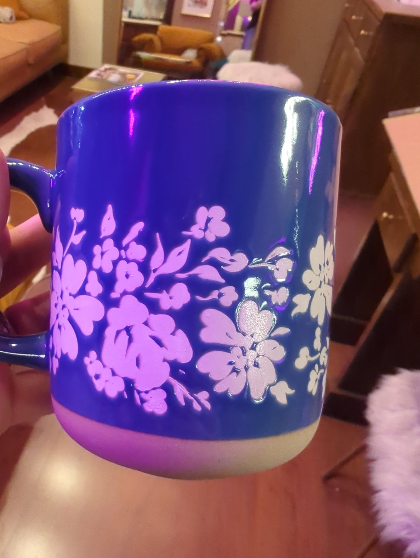 Floral stoneware coffee mug with colorful flower designs, handcrafted by Sweet Water Decor, perfect for hot beverages.