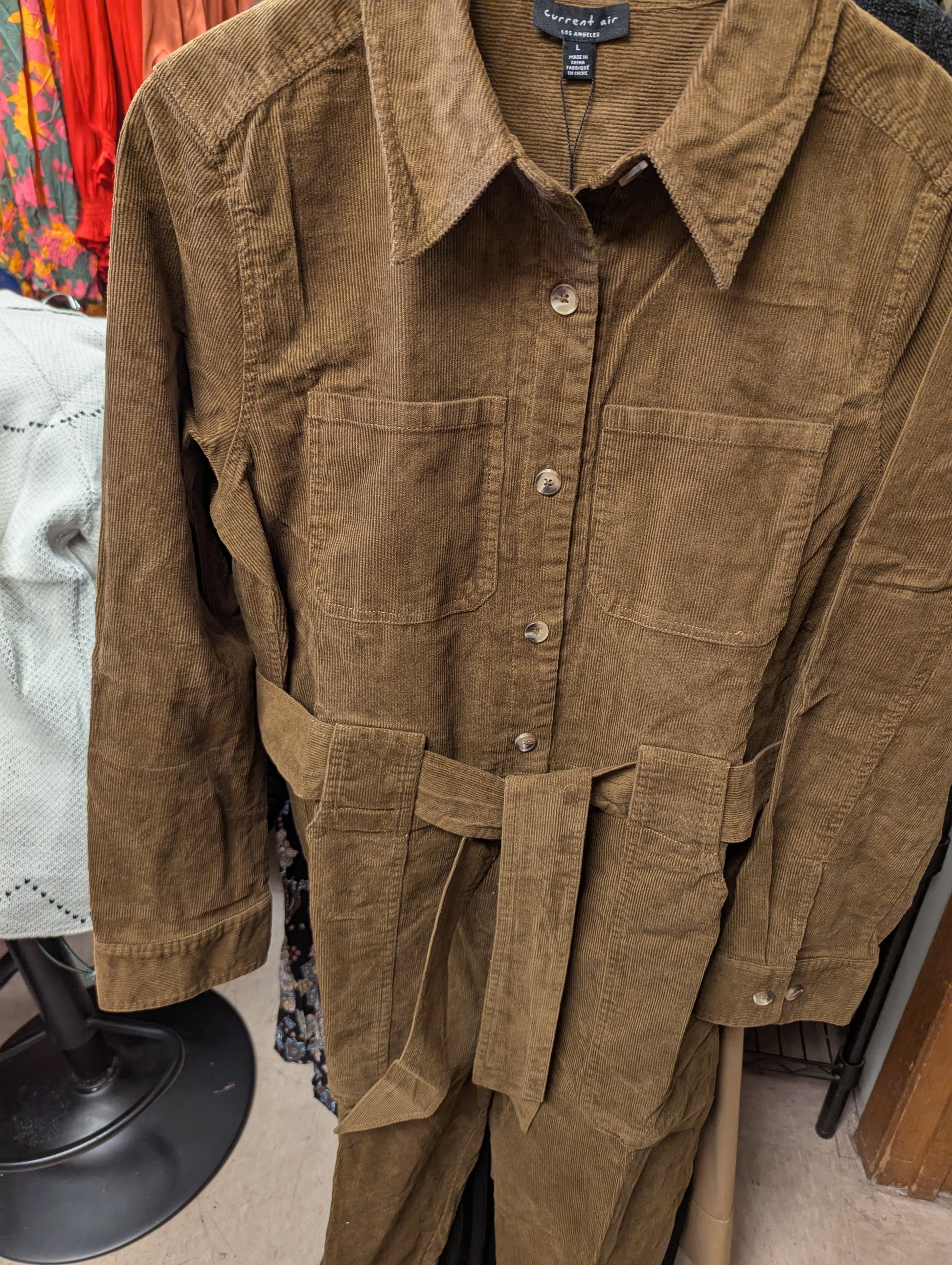 Brown Corduroy Jumpsuit by Current Air, featuring a relaxed fit with wide legs and adjustable straps, shown on a model.