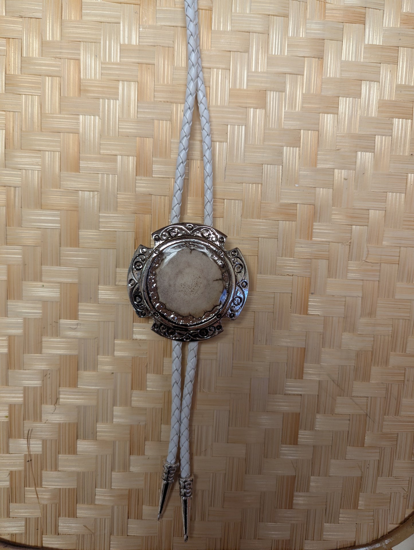 BadAssBabe Badass Bolo Tie with intricate silver-tone design and cord, stylish western accessory for men and women.