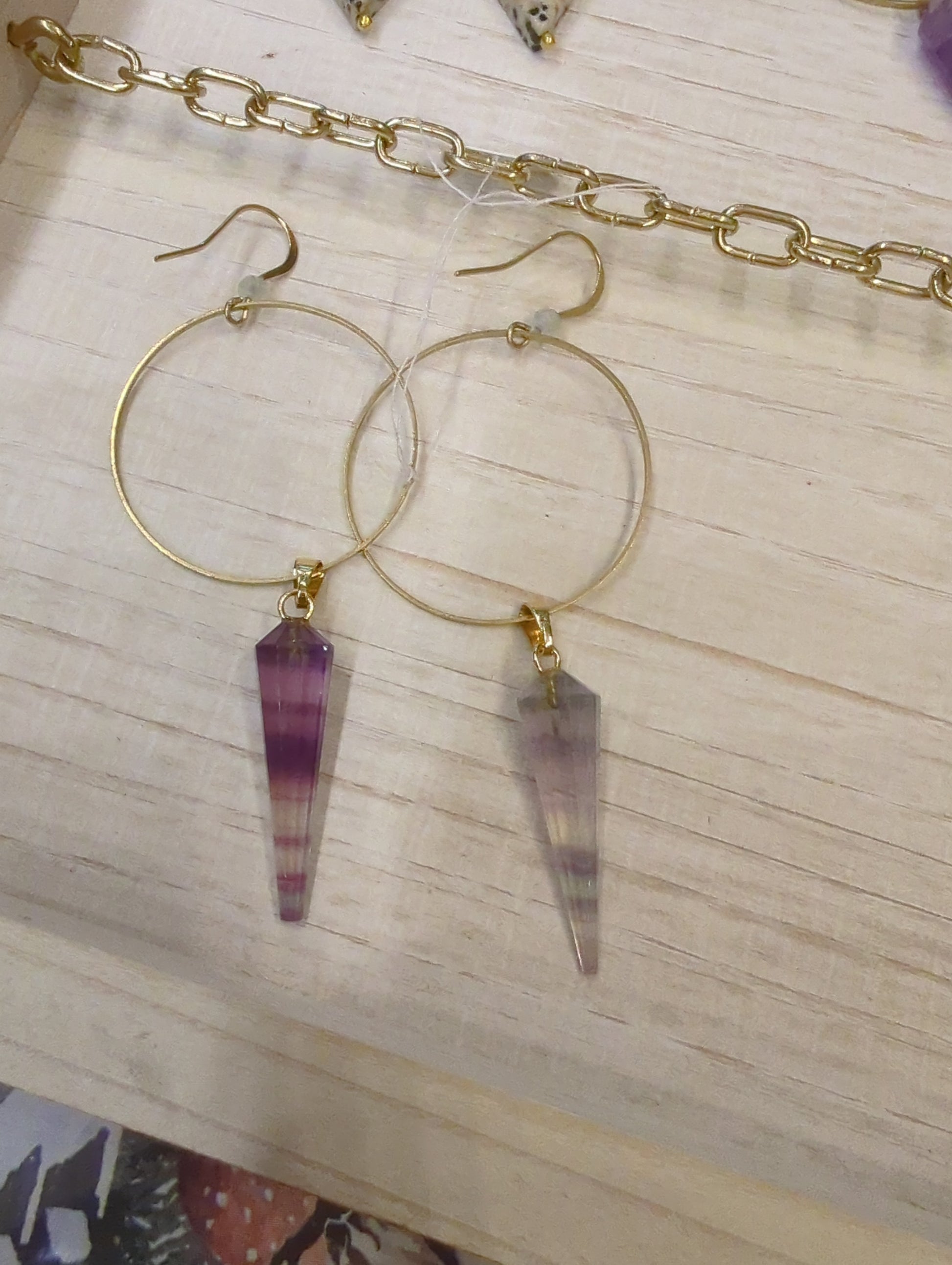 Fluorite prism and prehnite gemstone hoop earrings by Skipping Stones Jewelry, featuring large silver hoops with colorful gemstone accents.