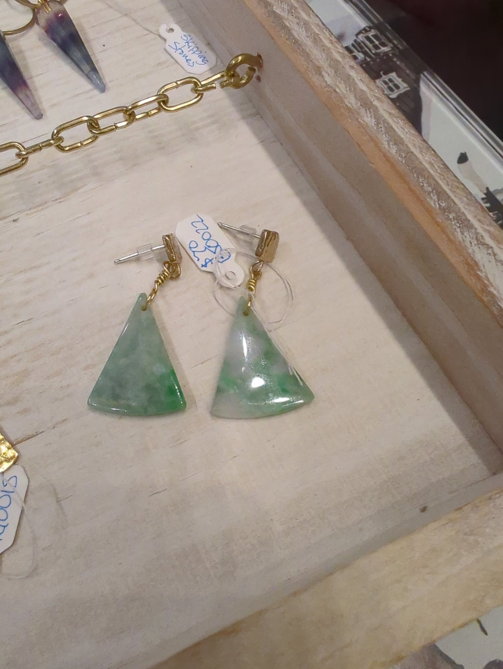 Burma Jade triangle post earrings by Skipping Stones Jewelry featuring smooth green jade stones on silver posts