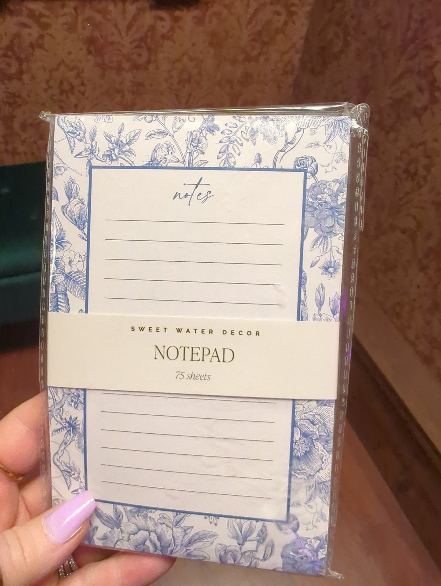 Sweet Water Decor notepad with floral design, featuring lined pages for journaling or note-taking.