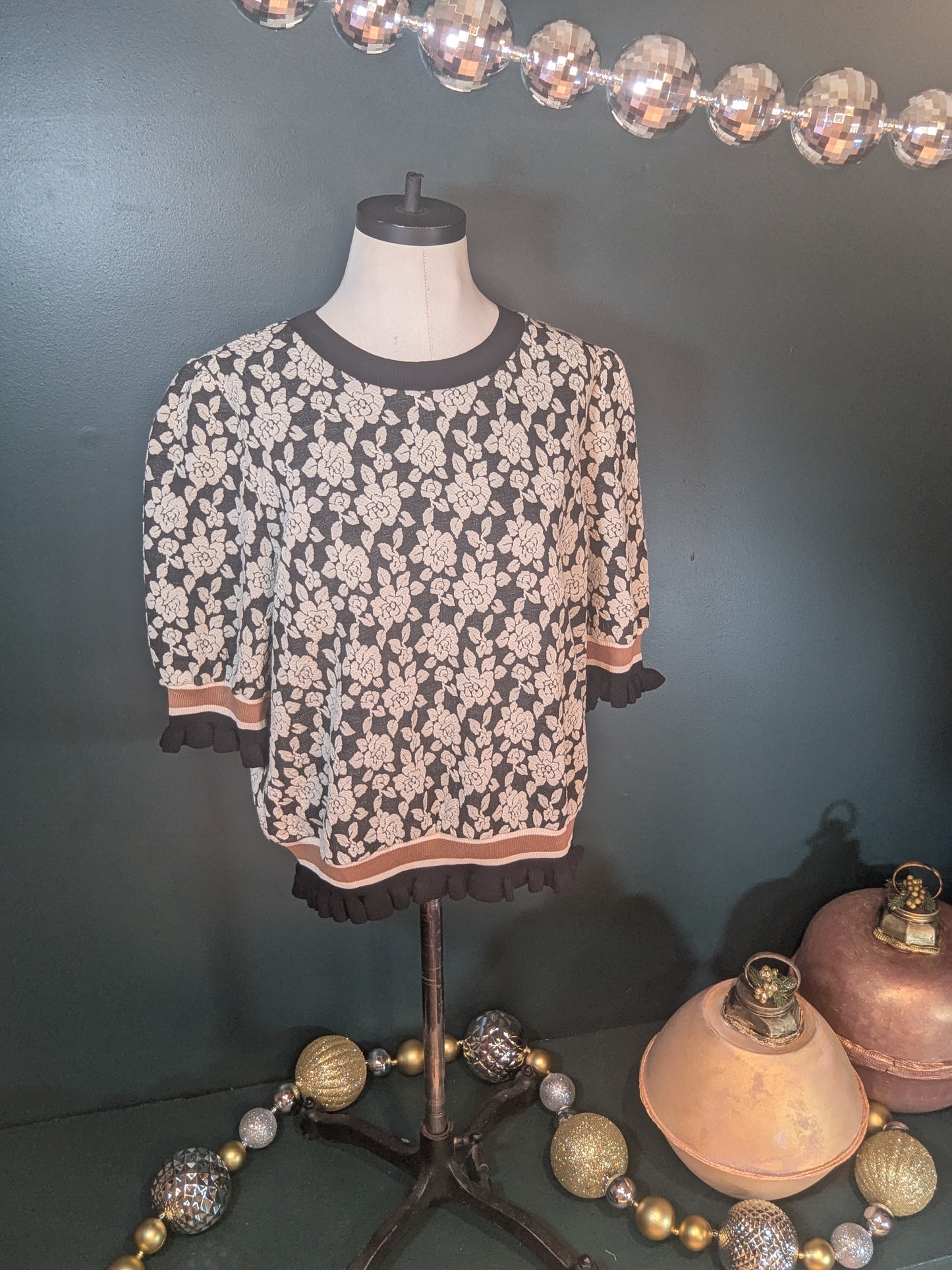 Pink "A Rose is a Rose" sweater by BiBi, featuring a cozy knit design with floral rose patterns.