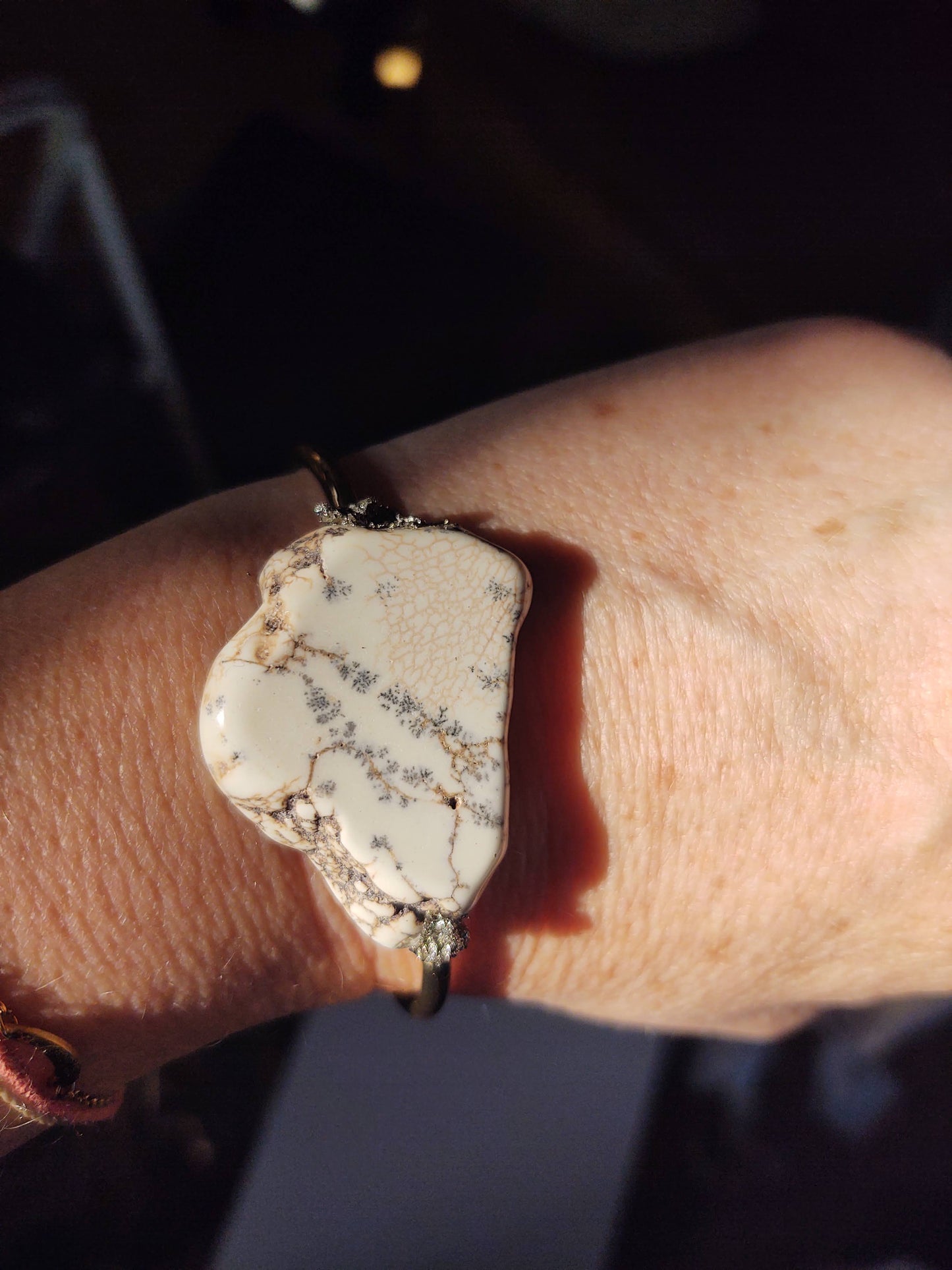 Howlite cuff bracelet by A Sparkling Mess featuring smooth white gemstone beads and a sleek metal cuff design.